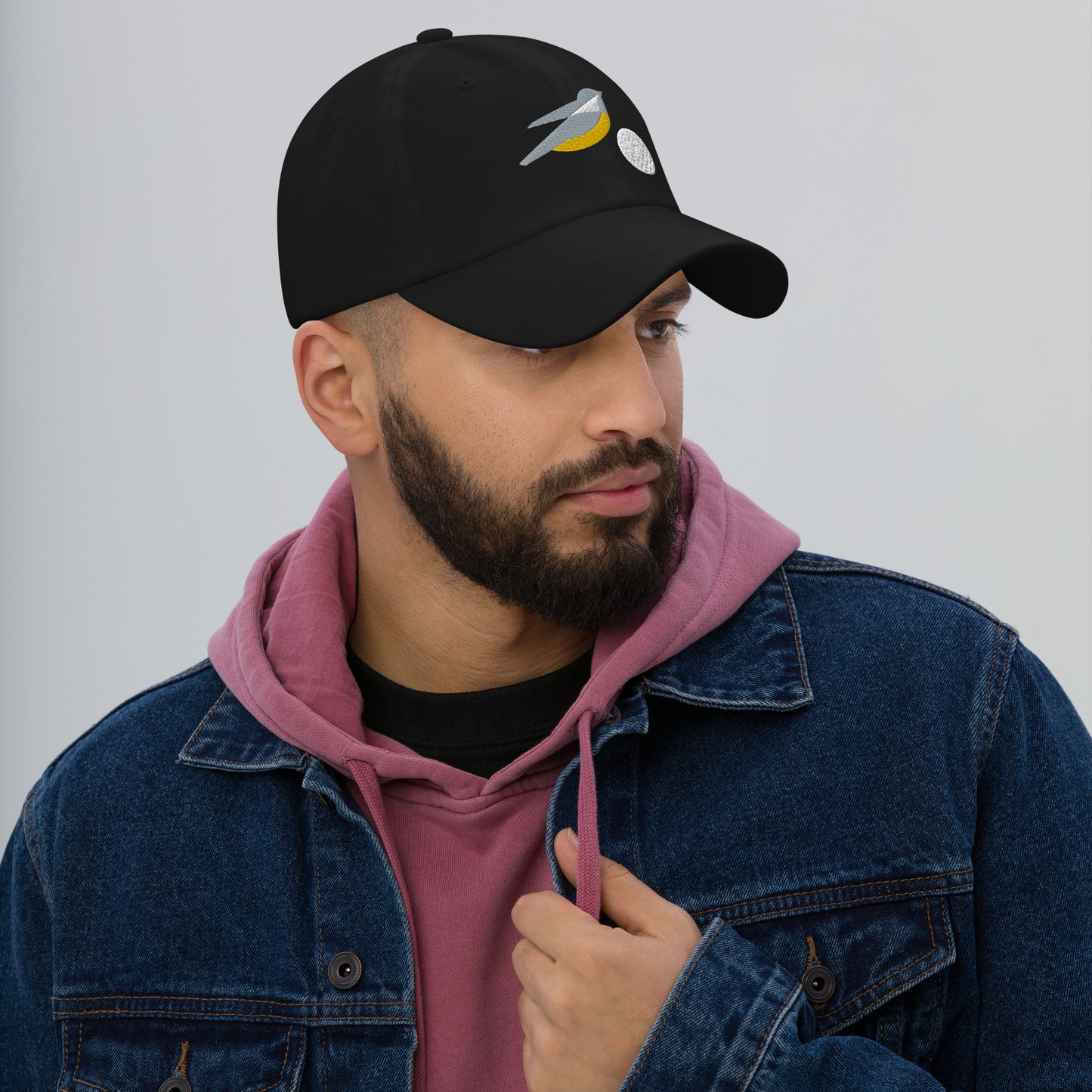 Cool golf hat with embroidered birdie and ball design in black