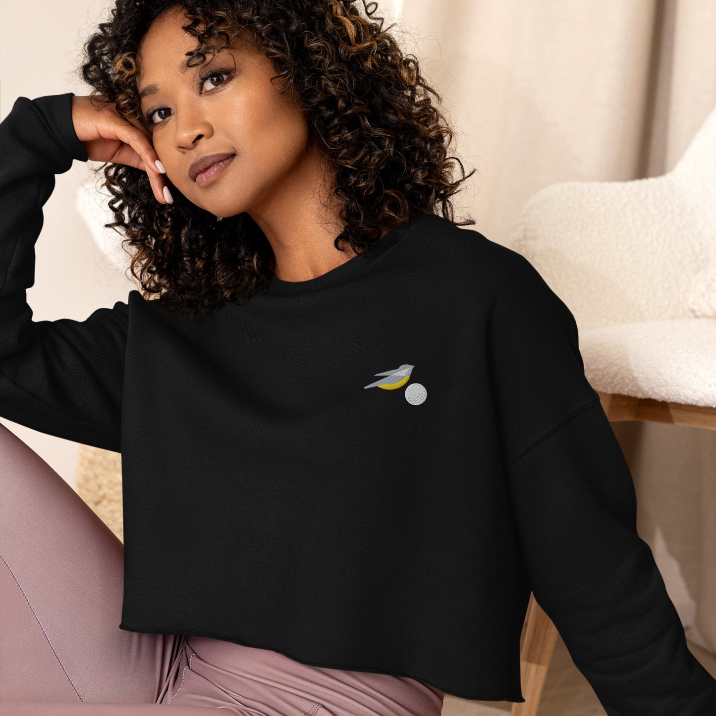 Womens cropped sweatshirt in black with embroidered birdie and ball design